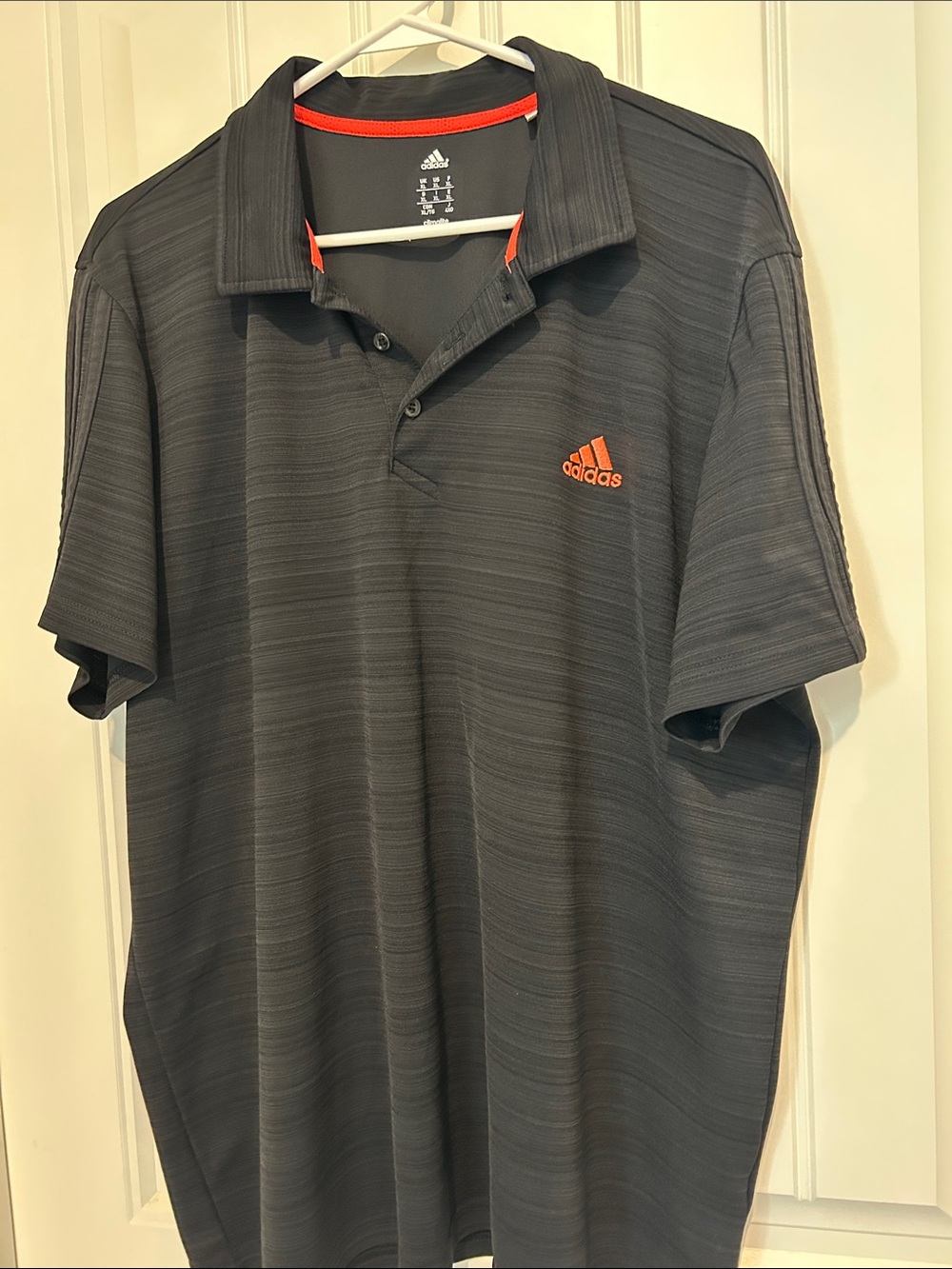 adidas Men’s black Polo with Orange Logo Trim